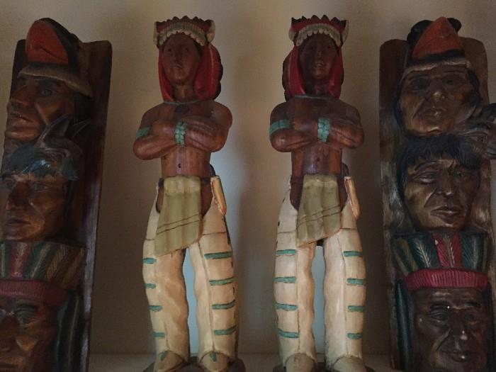 Totem poles and cigar store Indians.