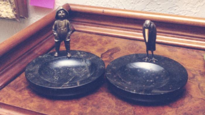 263/  Ashtray.  A contemporary American marble ashtray with bronze mounted figure.  A boy in boots and hat (so'wester).  5" high:  $225.  A contemporary American marble ashtray with bronze mounted figure.  A crane with what appears to be ivory bill.
3 1/2" high:  $185.