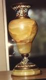 17/218  Urn.  A 19th century French urn in onyx.  The mouth, neck and pedestal in champlevé.  The whole is raised on an octagonal onyx base to match body.
5 1/2" high.  $200.00