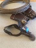 Vintage spurs, holsters and rope