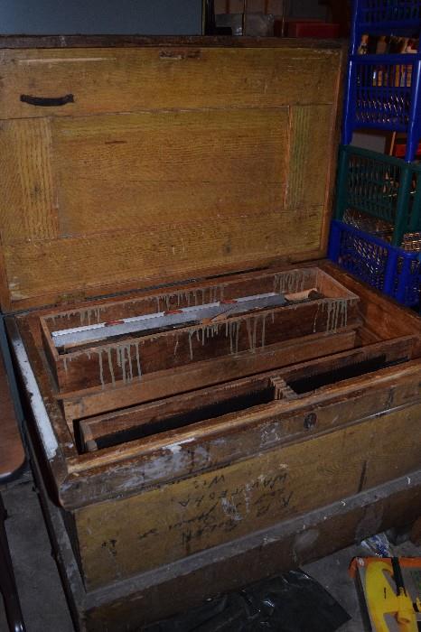 Antique wood tool storage. Trays slide back and forth to expose trays under neath