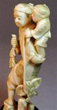 Chinese ivory man with child