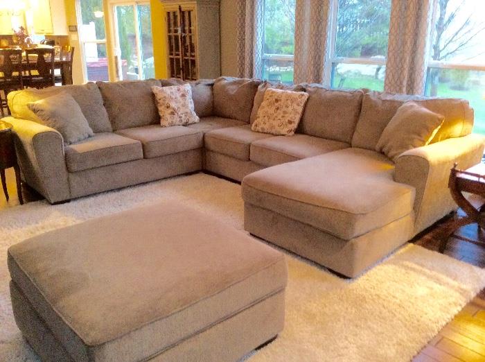 This stunning large neutral sectional and ottoman can still be purchased for over $1700.00. It's in excellent shape!