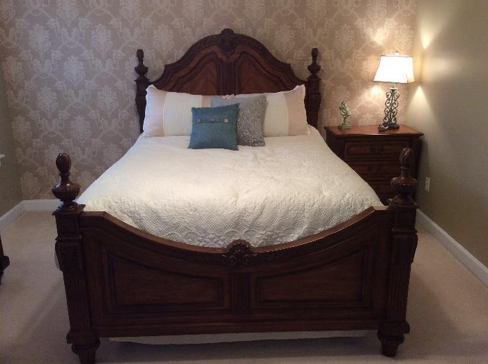 This quality queen bedroom set is by Universal Furniture. It includes a headboard, footboard, bedside table, dresser with mirror and tall chest of drawers. The queen pillow top mattress can be purchased with or separately from the set.