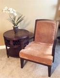 Vintage leather top barrel end table. Neutral contemporary side chair.