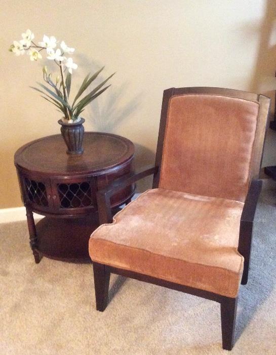 Vintage leather top barrel end table. Neutral contemporary side chair.