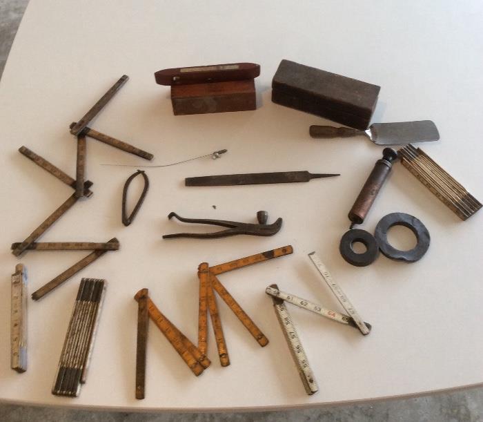 Vintage tape measures and tools.