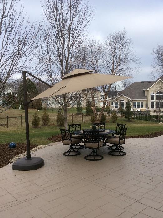 This high end patio table and chair set retails for $1000. How great does it look with this umbrella?