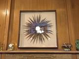 Feather art with mirror 4 ft x 4 ft, under glass.
