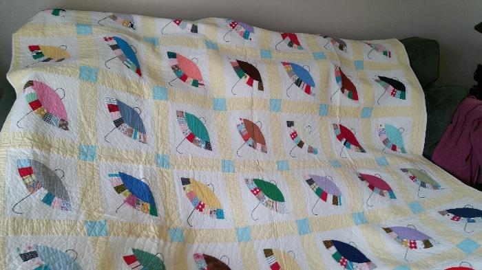 Probable 1930s Handquilted hand sewn quilt with charming umbrellas