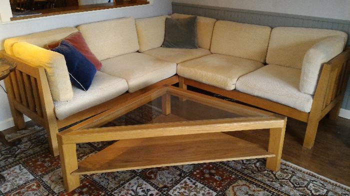 Very nice L Shape (comes apart if preferred) sofa with matching triangular coffee table.  Very well crafted with springs and removable cushion covers.  