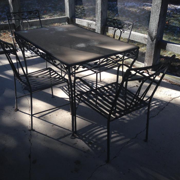 Very nice, heavy metal outdoor table with 4 chairs.