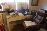 Desk, supplies and chair.