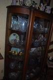 Beautiful antique china cabinet with lots of cut glass.