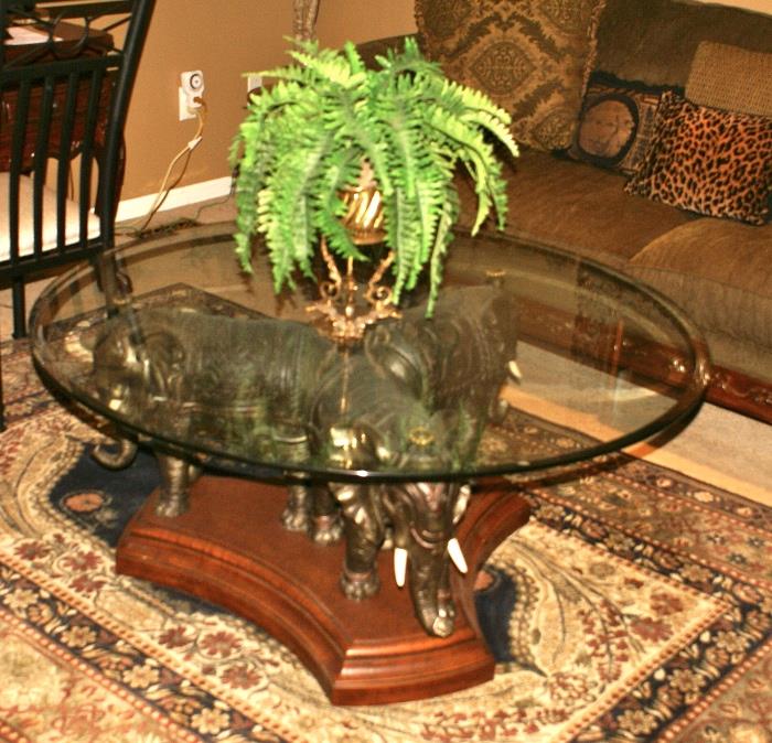 Wood Base Elephant Motif Round Glass Top Coffee Table.