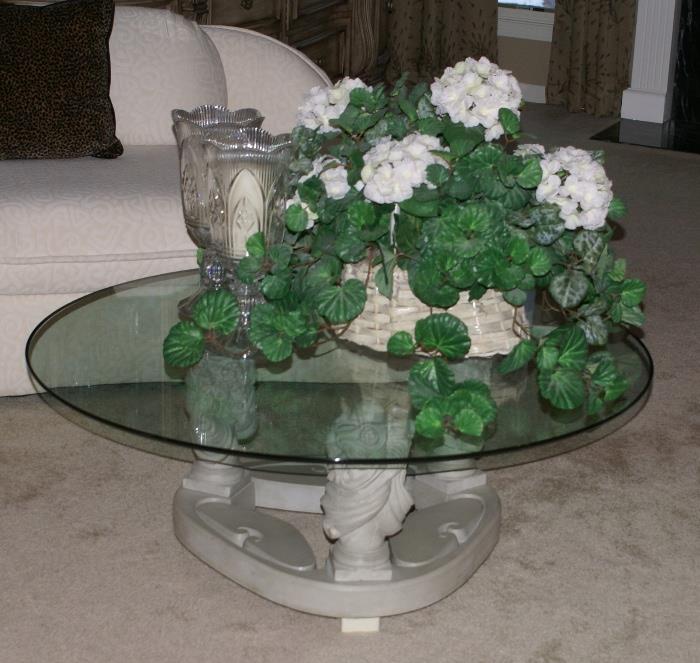 Close-up of Coffee Table with Floral Motif Design Base. Large Silk Flower Arrangement in Basket 