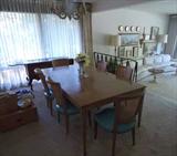Baker Dining Room Table has two extra leaves and pads