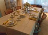 Baker Dining Room Table with Wedgwood China Set Up on It