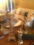 Candle holders, figurines, and leather bound books; sofa and love seat