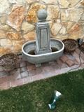 a small French style garden fountain