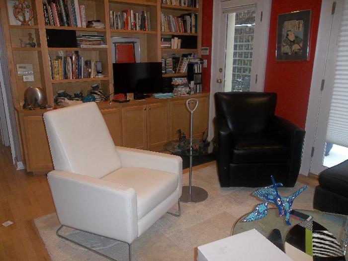Leather chairs White is Flight recliner designed by Jeffrey Bernett and Nicholas Dodziuk Black is Crate and Barrel swivel rocker, Tv, Stereo, Books, Tables, lamps, and more