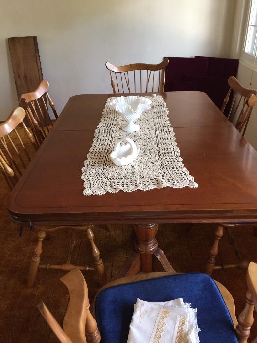 Large Dining Table in beautiful condition. Three leaves and pads .  Six Chairs
