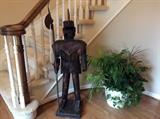A knight in armor greets you at the door!