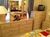 2nd bedroom furniture: triple dresser w/ mirror & 2 pivot mirros; 5-drawer highboy; nightstand. Raggedy Anne and Andy are on the dresser.