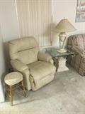 Old stool w/ hand-crocheted cover, Best Chairs recliner, beveled glass end table. 