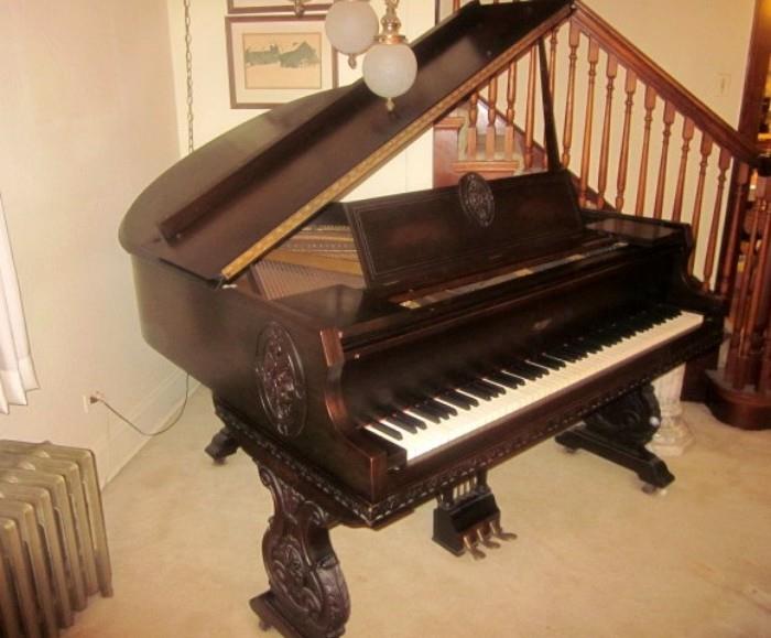 Vintage Apollo baby grand piano.  Great condition. Beautifully carved, with matching bench with storage area.  Made in Chicago!
