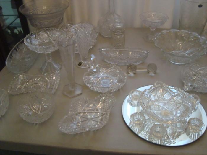Many pieces of cut glass, some signed.