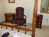 Leather executive chair, wood file cabinet, night stand, one of several mirrors.