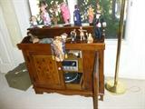 Beautiful stereo cabinet and dolls, puppets from around the world.