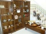 Bookcases, artifacts, drop leaf coffee table.