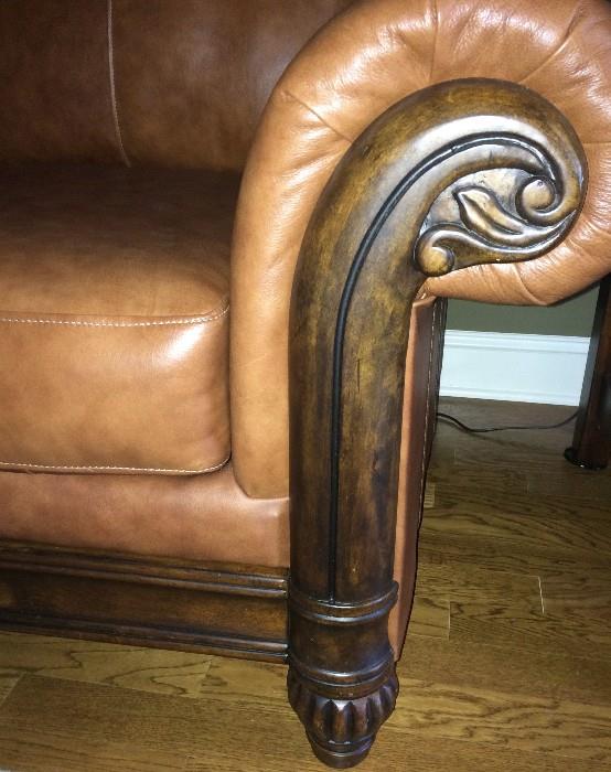Detail of wood framing on leather sofa, loveseat, and chair