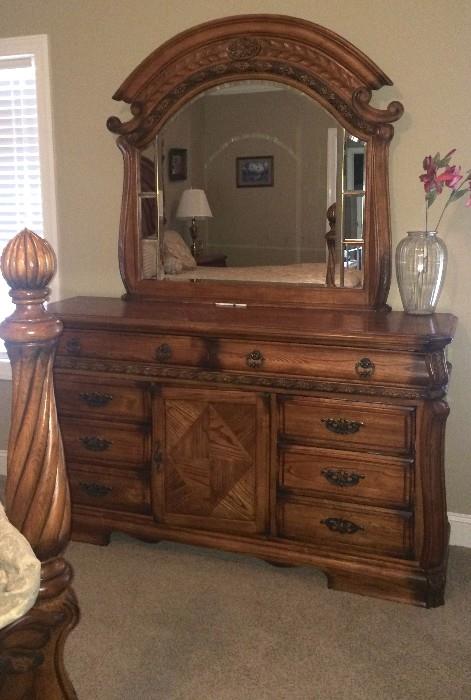Dresser with bevelled mirror and carved detail--matches king bed, side table, and armoire