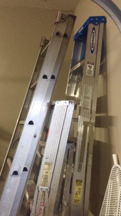 Four aluminum ladders