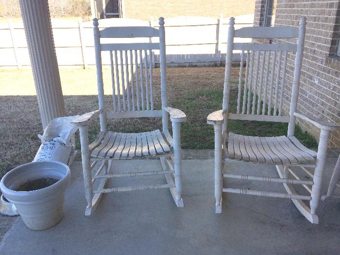 Wooden rockers with chippy paint and white ceramic pot
