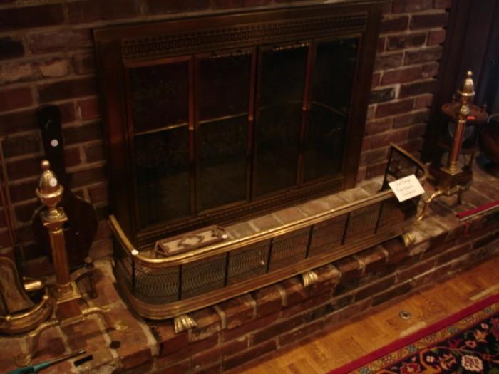 Vintage brass andirons and fireplace fender