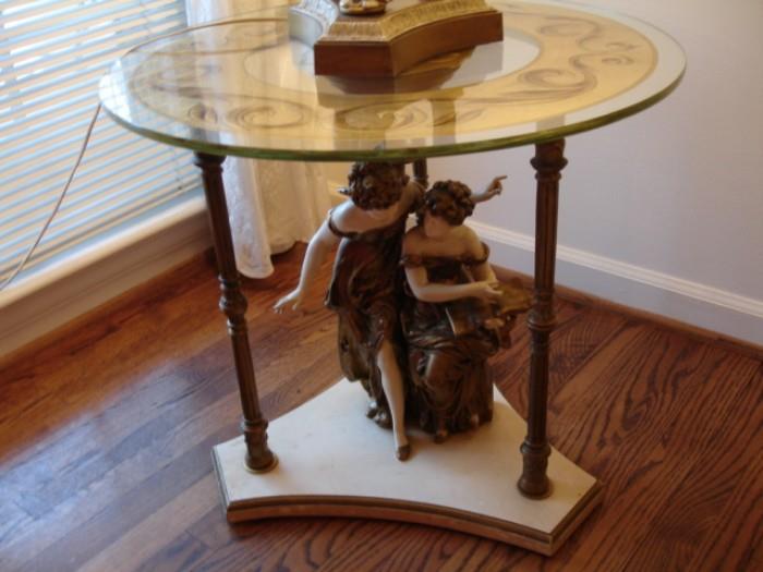 Unusual glass-top Regency-style table, with figure of two women below, by Collection Francaise