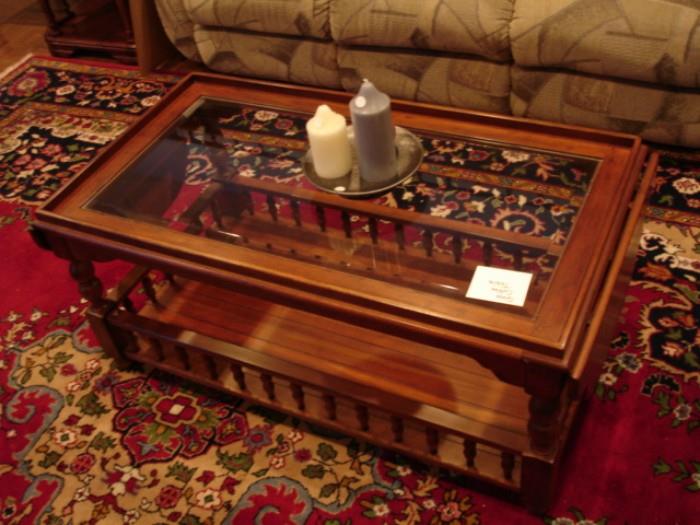 American Colonial-style coffee/cocktail table with glass inset top