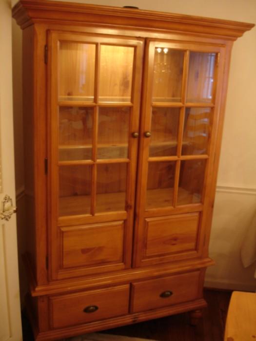 French rustic-style lighted china cabinet