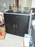 bar on wheels. storage in locking cabinet.  space for small fridge (not included).  