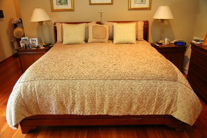 King size bedspread with matching pillows are the only items for sale in this picture.