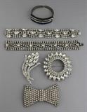 Lot 1022: VINTAGE RHINESTONE COLLECTION: BOWTIE BROOCH, SUNFLOWER BROOCH, FLOWER BROOCH, TWO BRACELETS AND A HINGED CUFF http://www.invaluable.com/auction-lot/vintage-rhinestone-collection:-bowtie-brooch,-sun-1022-c-51a4018851