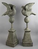 Lot 1073: PAIR OF COMPOSITE GARDEN ORNAMENTS WITH FIGURE OF A DOVE ATOP SPHERE ON A PYRAMID BASE http://www.invaluable.com/auction-lot/pair-of-composite-garden-ornaments-with-figure-of-1073-c-32e4fd38a8