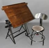 Lot 1083: VINTAGE ADJUSTABLE OAK AND CAST IRON DRAFTING TABLE WITH DRAFTING PAPER ROLL HOLDER TOGETHER WITH AN ECLECTIC METAL DRAFTING CHAIR http://www.invaluable.com/auction-lot/vintage-adjustable-oak-and-cast-iron-drafting-tab-1083-c-b7a4d0cbee