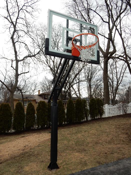 Pro Dunk Gold Basketball. In-ground regulation size with glass backboard. Easy crank adjustment. New 4 J-Bolt Pier Kit is available online to install in a new location.