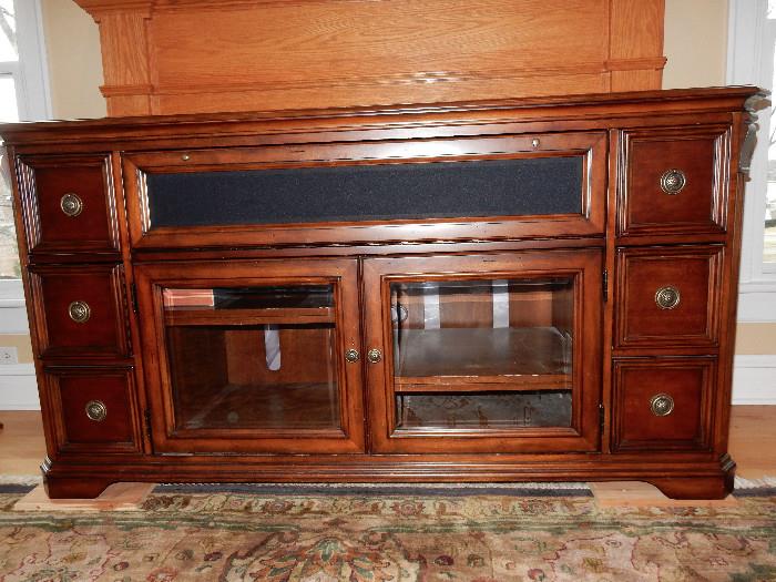 Stereo Cabinet with room for center speaker or sound bar. Also comes with wood fronts to replace glass if that is your desire.
