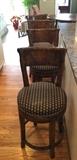 Four Swivel Counter Height Stools by the Sterling Collection